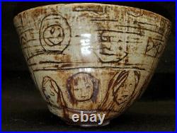 Studio pottery bowl with Faces