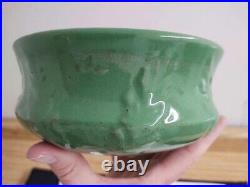 Vtg. Green glazed pottery ceramic bowl with raised leaves design